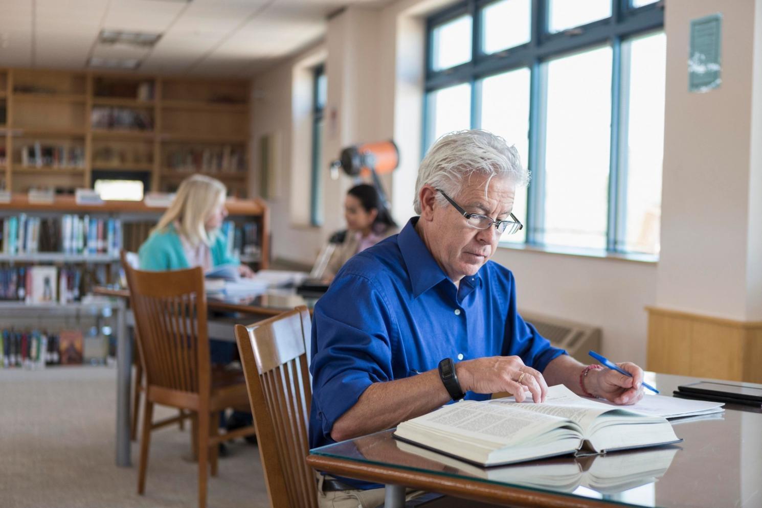 Designer working on product interface with multiple screens
